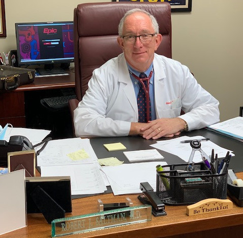 Dr Saltman Sitting at his Desk