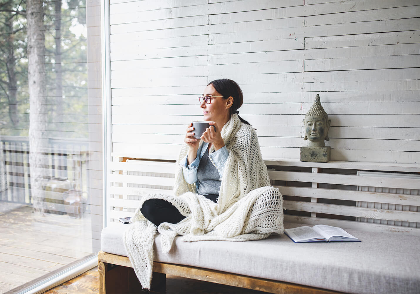 Woman relaxing with cup of coffee