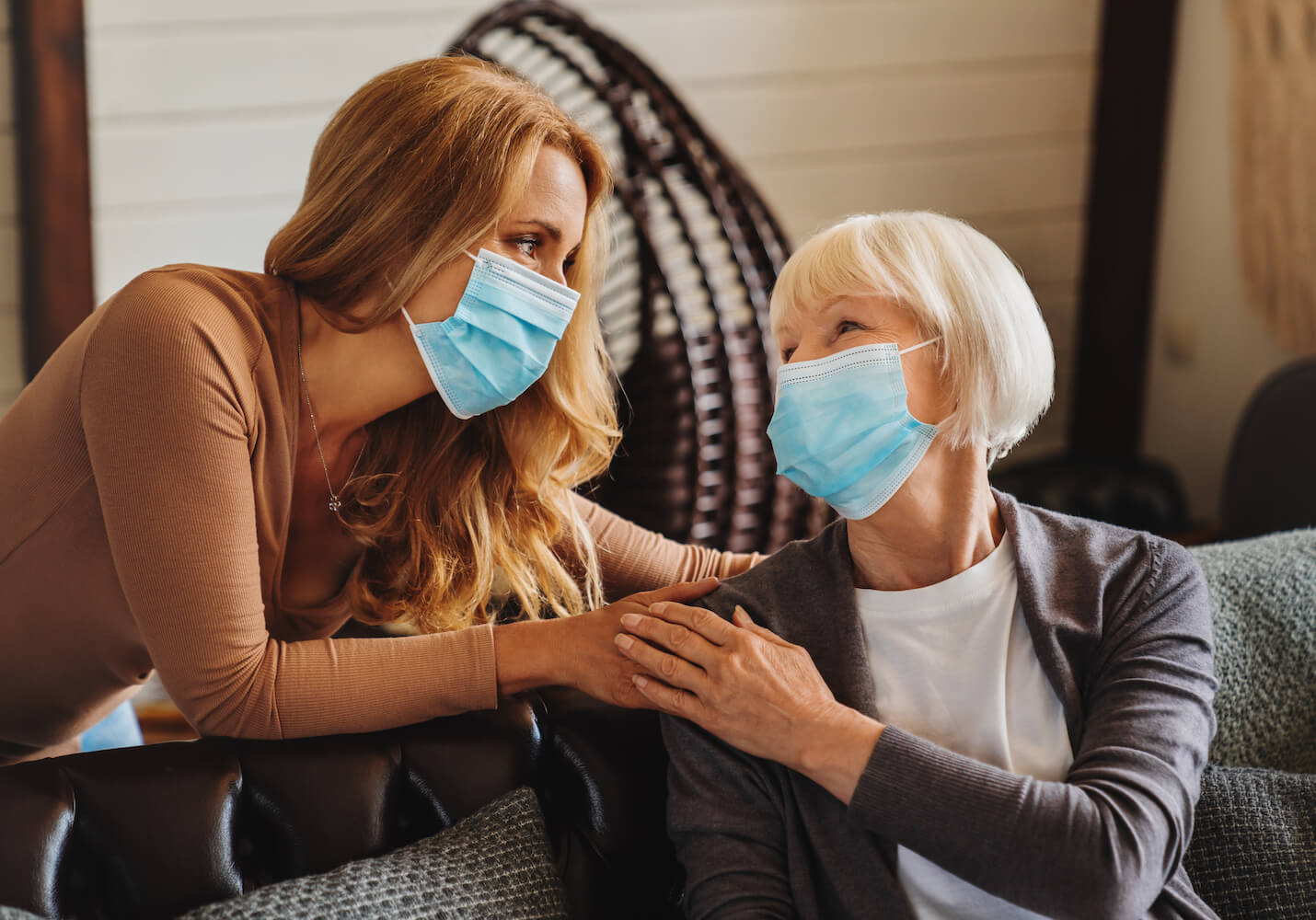 Two women wearing masks