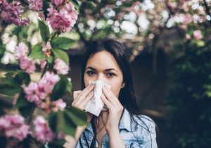 Woman using a facial tissue