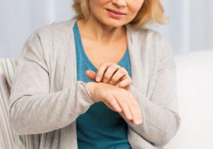 Woman itching hand