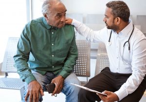 Older male patient with doctor