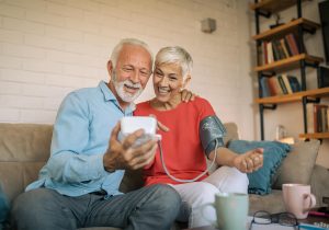 Senior couple measuring blood pressure