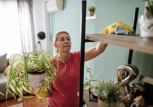 Woman cleaning furniture