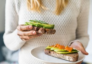 Plate of healthy fats such as avocado and salmon