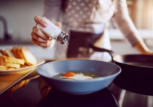 Salt being added during food preparation