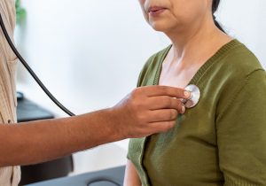 Doctor using stethoscope